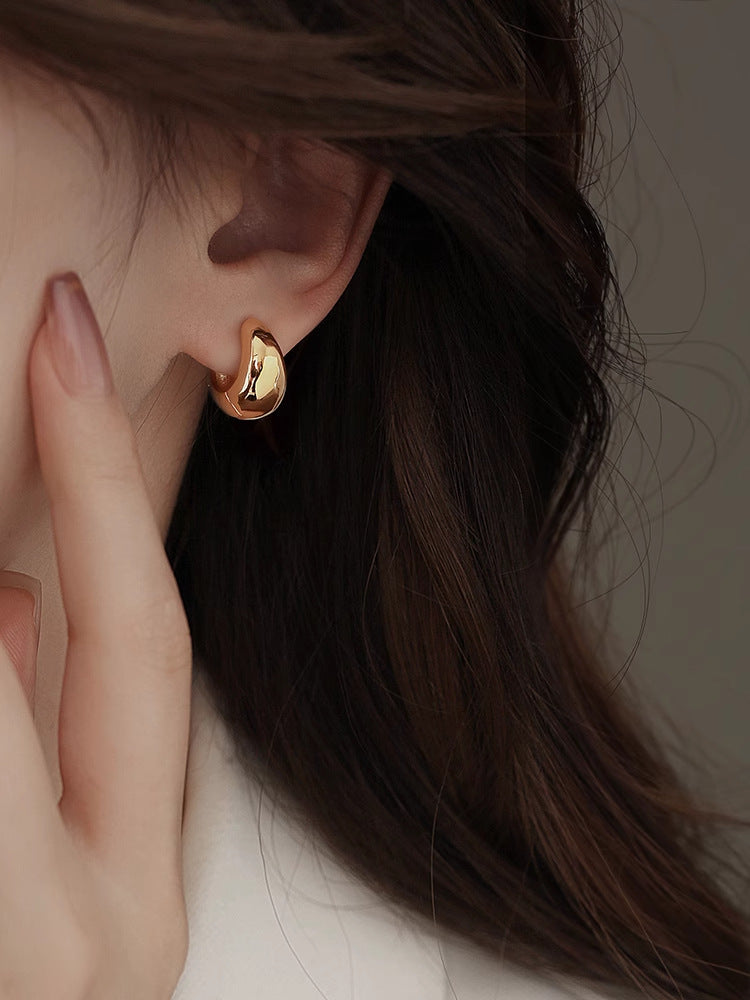 Modern Curved Gold Earrings — Contemporary Classic